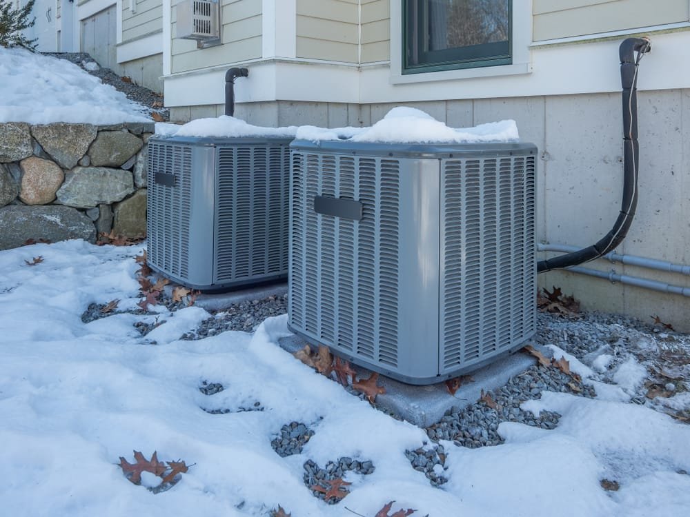 Prevent dry winter air with your HVAC system - which is standing in the snow.
